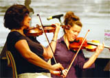 Musicians of London Philharmonic Orchestra perform at a music workshop for school students at the British Council in New Delhi 