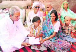 Chief Parliamentary Secretary Prahlad Singh Gillankhera with Krishna and her children