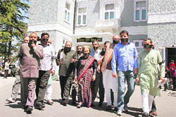 Congress Legislative Party leader Vidya Stokes and other Congress MLAs wear black strips on their faces in protest against the registration of an FIR against a Congress MLA, at Shimla 