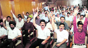 Members of the J&K Diploma Engineers Association hold a demonstration in Jammu on Wednesday.