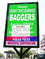 A poster pasted on an information board put up by the traffic police in Ludhiana. Photo: Inderjeet Verma