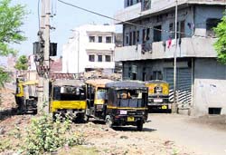 Auto-rickshaws parked along a road in Haibowal, Ludhiana, creating nuisance for motorists. Photo: Inderjeet Verma
