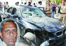 The BMW car that killed Om Dutt Chauhan (inset) near Akshardham Temple in East Delhi on Thursday.