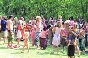 Foreigners, who have come for the Maha Kumbh, enjoy a musical party in the Raja Ji National Park near Rishikesh