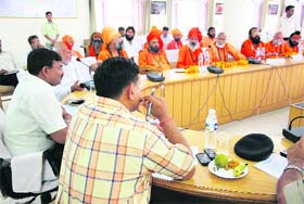 A meeting of mela administration officials and saints in progress in Haridwar