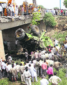 A combine that fell off a bridge on the Hisar road in Rohtak on Thursday.
