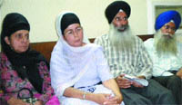 Surinder Kaur, mother of Harjinder (left), along with other family members in Phagwara 