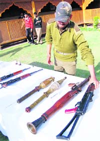 Weapons recovered from a militant hideout in Budgam district on display at Humhama police station