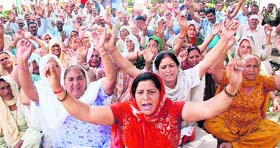 Activists of the DPS Front protest in support of their demands in front of the Divisional Commissioners office in Jammu