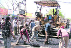 The approach road to Guru Nanak Stadium being re-carpeted for the upcoming final of World Kabaddi Cup.