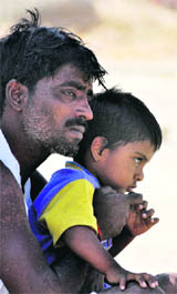 Three-year-old Shivam during the cremation of his father, CRPF soldier Ranjit Kumar Yadav, who was killed in Dantewada Maoists attack, at Rasoolabad Ghat in Allahabad on Thursday.