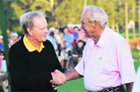 Legendary golfers Arnold Palmer (R) and Jack Nicklaus shake hands at the ceremonial opening of the Masters tournament in Augusta
