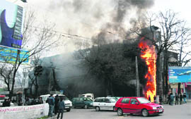 A shopping centre burns in the centre of Bishkek on Thursday. 