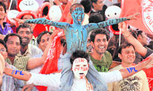 Kings XI supporters celebrate Sachin Tendulkars dismissal.