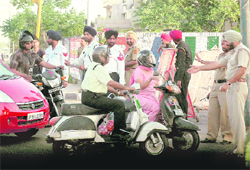 Residents argue with cops at the entrance of the PCA Stadium on Friday