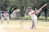 A batsman misses the ball in a match of the Hukum Singh Memorial Cricket Tournament played in Dehradun