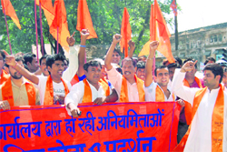 Shiv Sena activists protest in front of the District Supplies officers office against irregularities in ration distribution in Dehradun on Friday
