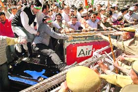 Congress activists involved in a scuffle with the police, protesting against the state government for its inability to control prices of essential items at Shimla