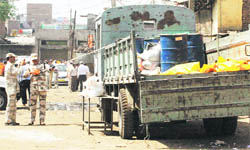 A truck being checked for radioactive leakage.