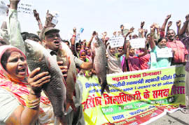 Fishermen during a protest against the alleged anti-fishermen policy of the Bihar government in Patna on Friday.  PTI