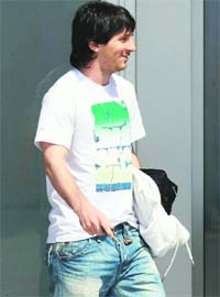 Barcelonas Lionel Messi comes out after a training session