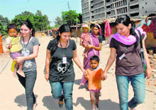 These three girls from the Students of the Centre of Social Welfare waited for Bobby (4), Arun (2) and Sandeep (1) to finish their meal for over 20 minutes in the scorching heat to take them to the Panjab University dispensary (accompanied by an apprehensive mother, who wished to come along).