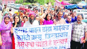 Members of the Jammu Migrants Front hold a protest against the non-implementation of the Supreme Court orders for the grant of benefits as applicable to Kashmiri migrants, outside the Divisional Commissioners office in Jammu on Saturday.
