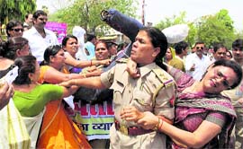 Women traders clash with police during a protest held to demand arrest of killers of a fellow trader, in Allahabad on Saturday. 