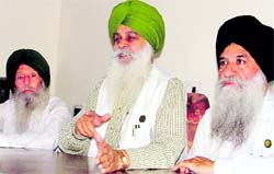 BKU chief Ajmer Singh Lakhowal makes a point regarding support to the unbundling of the PSEB in Ludhiana on Saturday. A Tribune photograph