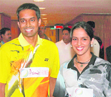 Saina Nehwal (R) and Pullela Gopichand during a press conference for the Yonex-Sunrise Badminton Asia Championship 2010 in New Delhi on Saturday.