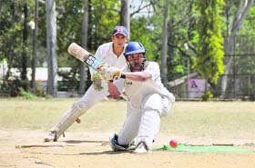 A batsman tries to sweep the ball at the OFD Cricket Tournament in Dehradun