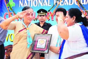 Uttarakhand Governor Margaret Alva salutes on being felicitated at the centenary celebrations of guides in Dehradun