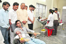 Congress workers donate blood at a camp held on the occasion of the 125th anniversary of the party in Dehradun on Sunday. 