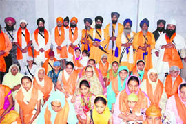 Sikhs who took Amrit at a function in Dehradun on Sunday.