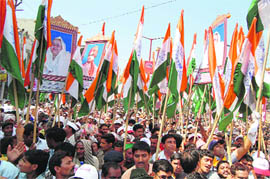 Followers take part in a procession of spiritual guru Satpal Maharaj in Haridwar on Sunday. 