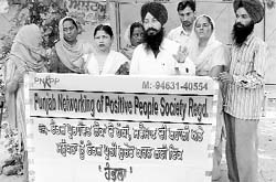 Outreach workers protesting in Ludhiana on Sunday. 