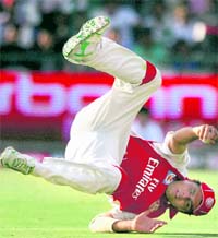 Kings XIs Reetinder Sodhi takes a catch to get rid of Rajat Bhatia on Sunday.  PTI