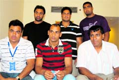 Indian captain Mangat Singh Mangi (C) with coaches in Ludhiana on Sunday. A Tribune photograph