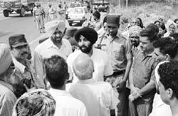 Banur constituency MLA Jasjeet Singh Bunny pacifies villagers who were trying to block the Chandigarh-Ambala highway at Zirakpur