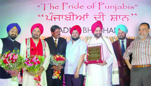 The Delhi Punjabi Bhaichara honoured Padma Shri awardee Sant Chatwal at a function held in New Delhi last night. Others honoured at the function were B. S. Ramoowali, Gen J.J. Singh, Kapil Dev and former CBI chief Joginder Singh.
