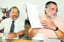 Dr Kamal Tawri (retired IAS officer) addresses a press conference in Dehradun on Monday. A Tribune photograph