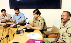 Mela officials with Hyderabad-based Indian Police Academy instructors in Haridwar on Monday. Tribune photo: Rameshwar Gaur