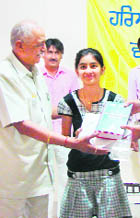 A student being honoured at a function in Sirsa on Monday.