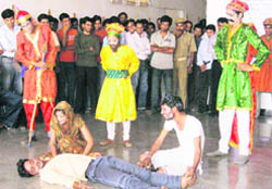 Students of the Deenbandhu Chhotu Ram University of Science and Technology present a street play on the university campus in Murthal