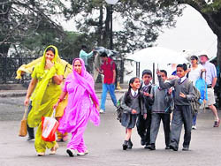 Shimla experienced rain on Monday, bringing the temperature down. Tourists as well as residents welcomed the showers.