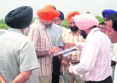 Special Principal Secretary to Chief Minister KJS Cheema on his survey in Changar area of Anandpur Sahib on Monday. 