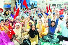 Members of the Technical Services Union of the PSEB hold a protest against the unbundling of the board in Bathinda on Monday.