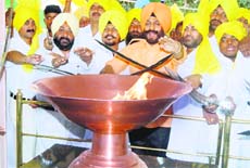 MS Bitta, chairman of the Anti-Terrorist Front, along with other members pays tributes to the martyrs at Jallianwalla Bagh in Amritsar on Monday. 