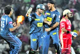 Deccan Chargers Harmeet Singh celebrates with teammates the wicket of Robin Uthappa in Nagpur on Monday.  PTI 