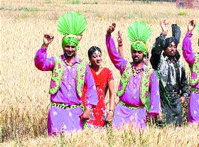 Youngsters take part in Baisakhi celebrations in a field in Amritsar.